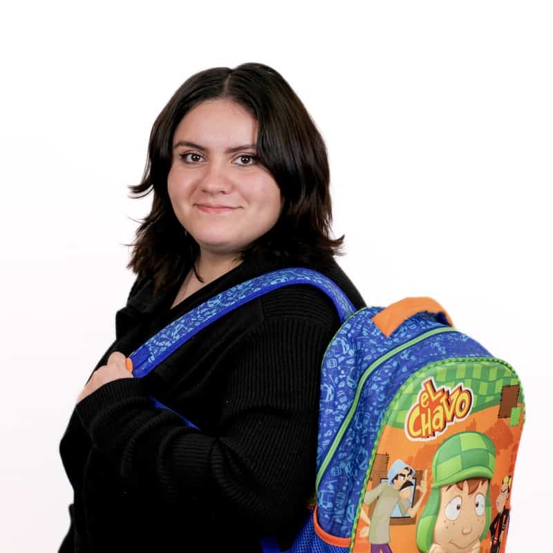 Woman smiling with a backpack featuring "el chavo" characters in Omaha.