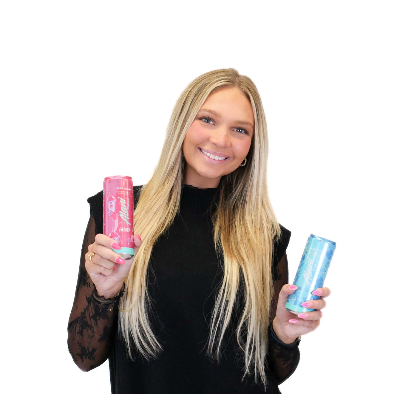 A woman with long blonde hair smiles while holding a pink can in her right hand and a blue can in her left hand against a white background.