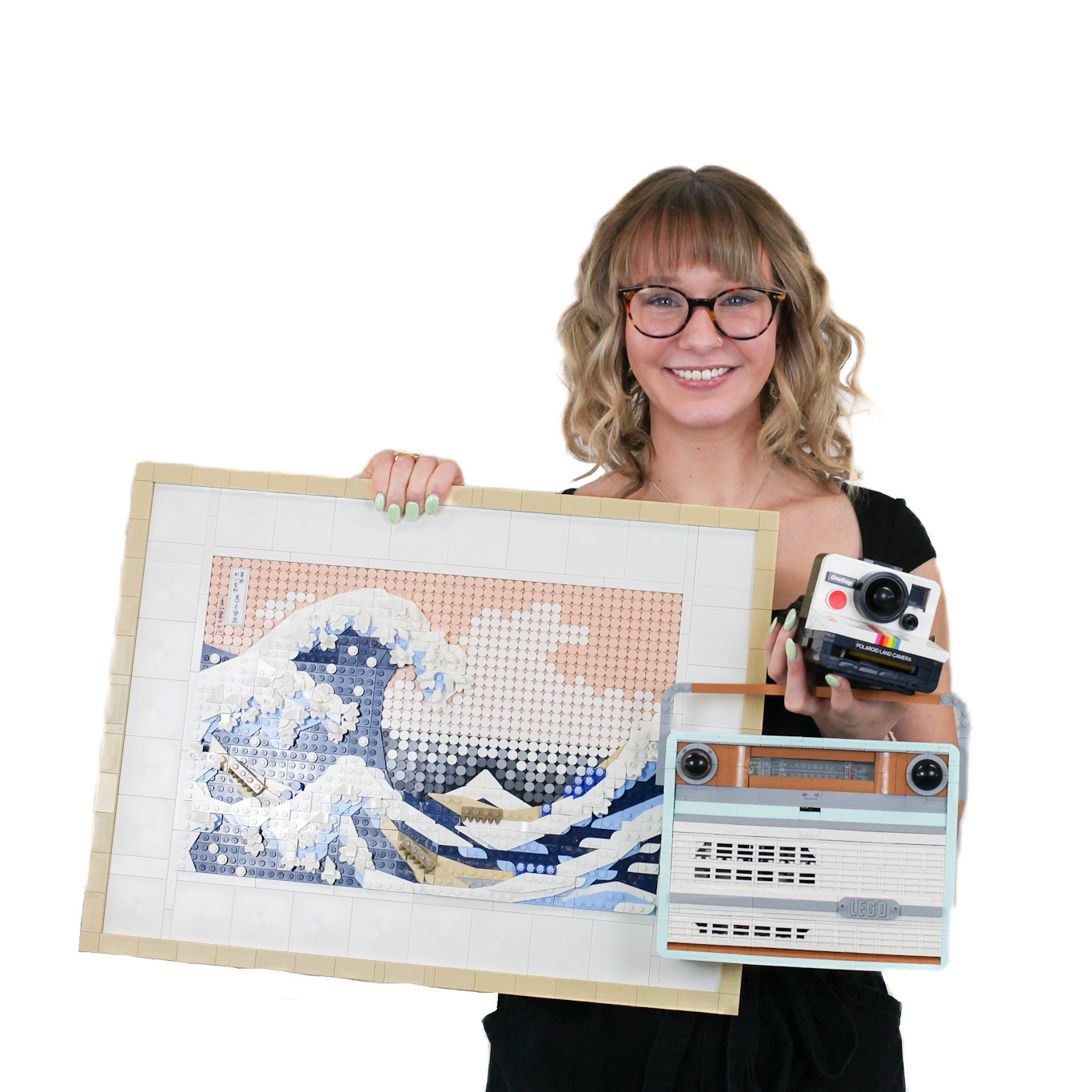 A woman with glasses holds a mosaic of "The Great Wave off Kanagawa," a vintage camera, and a retro radio against a white background.